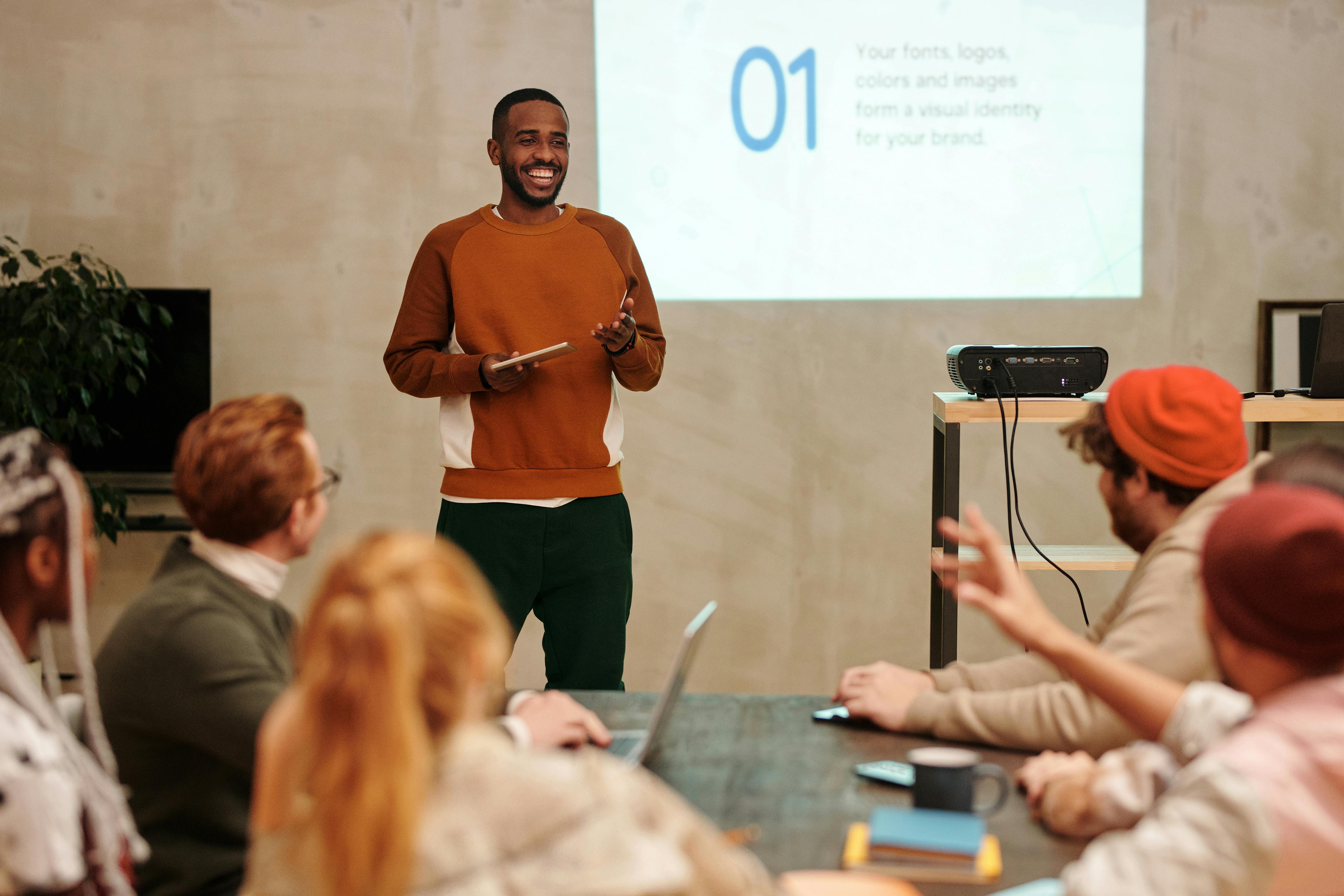 Man presenting marketing content to a team in a conference room